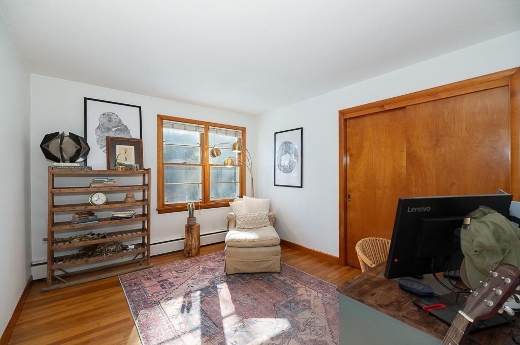29 Old Ferry Road Haverhill, MA 01830 - Photo 19 of 42 a living room with furniture a bed and a window