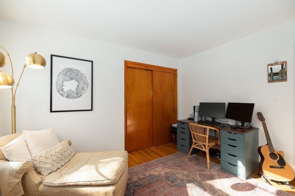 29 Old Ferry Road Haverhill, MA 01830 - Photo 20 of 42 a bedroom with a bed and a workspace