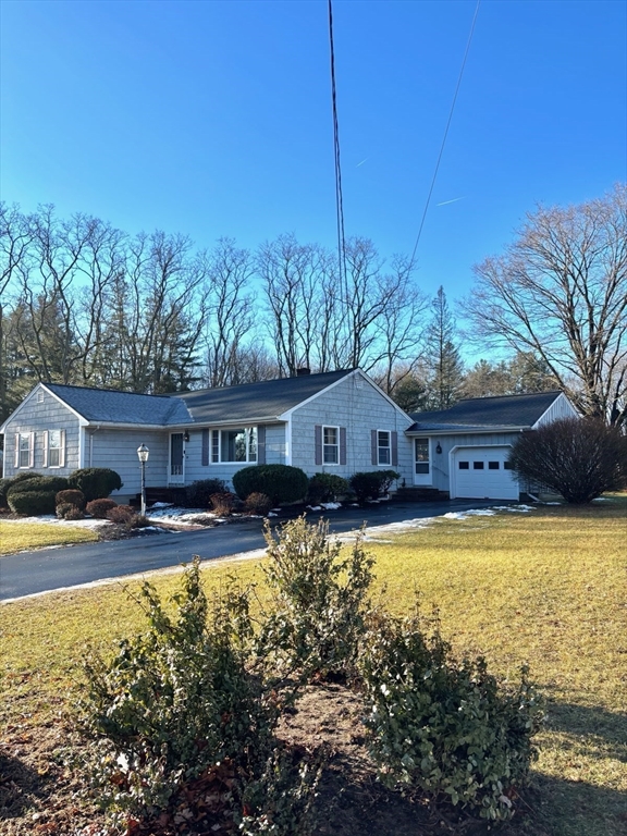 29 Old Ferry Road Haverhill, MA 01830 - Photo 39 of 42 a front view of house with yard and trees in the background