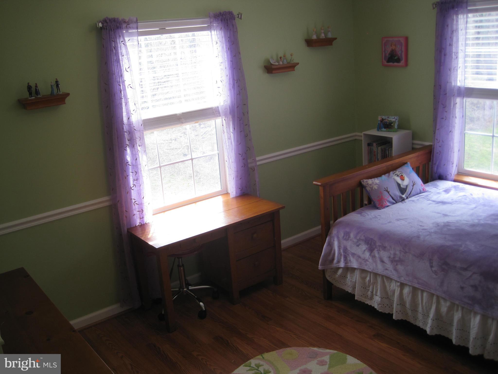 541 Stringtown Road Berryville, VA 22611 - Photo 14 of 19 a bedroom with a bed and windows
