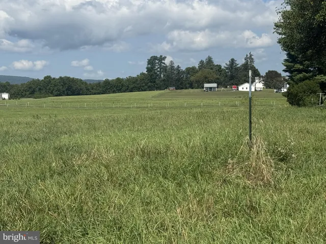 a view of a golf course with a lake