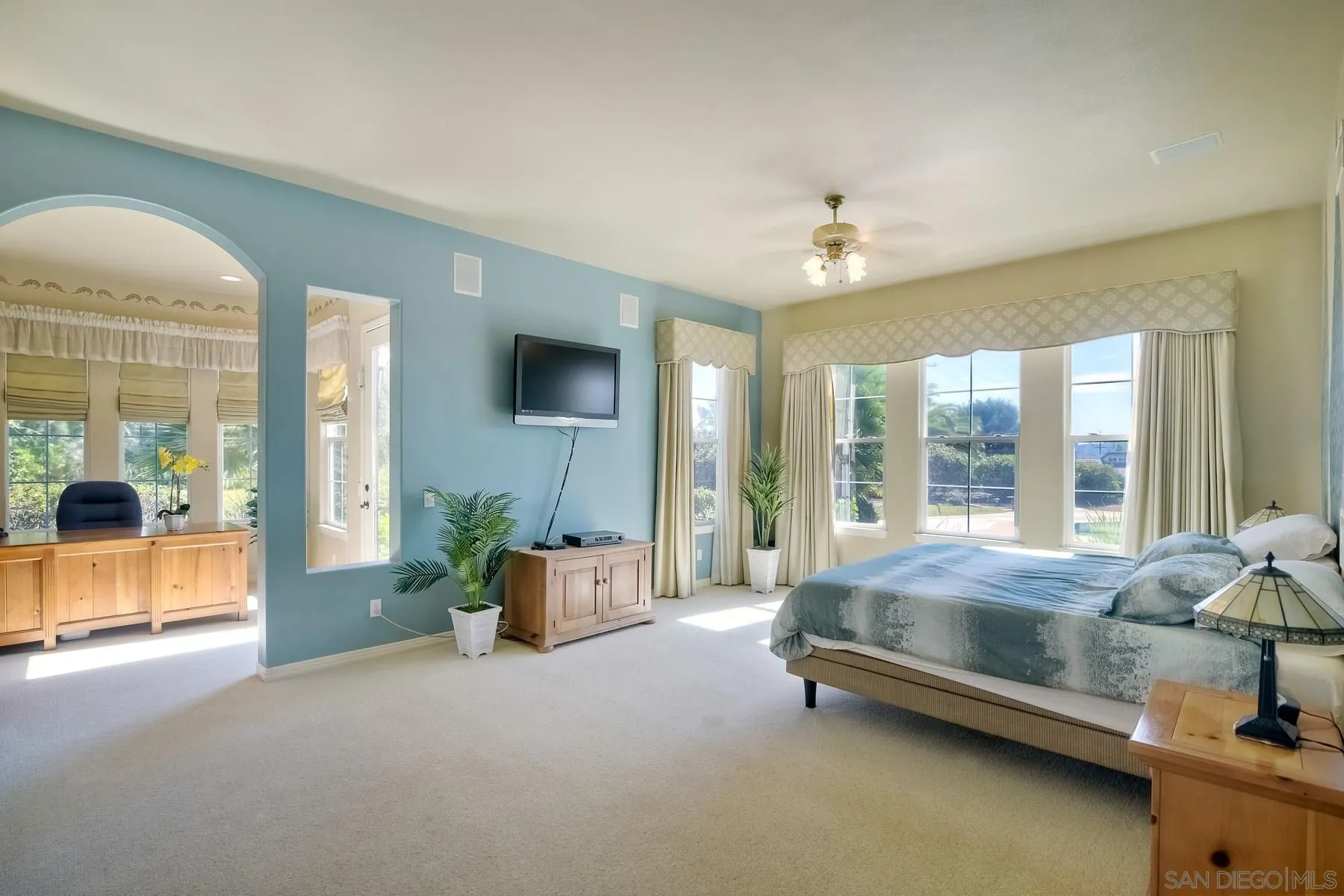13675 Antelope Station Poway, CA 92064 - Photo 16 of 33 a spacious bedroom with a bed and glass walk in closet