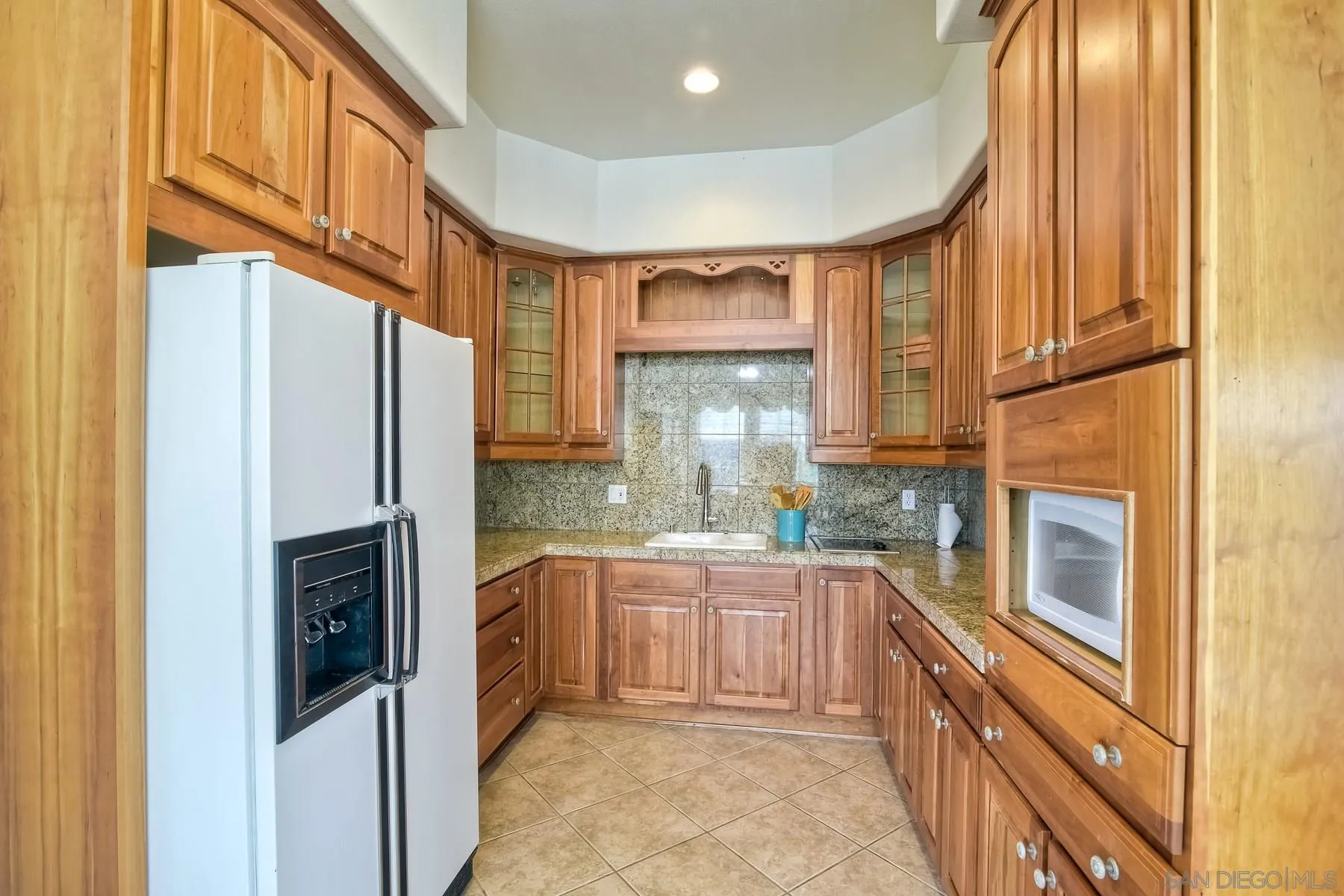 13675 Antelope Station Poway, CA 92064 - Photo 27 of 33 a kitchen with stainless steel appliances granite countertop a refrigerator and a sink