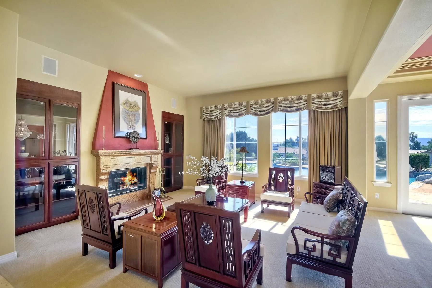 13675 Antelope Station Poway, CA 92064 - Photo 4 of 33 a living room with furniture fireplace and a large window