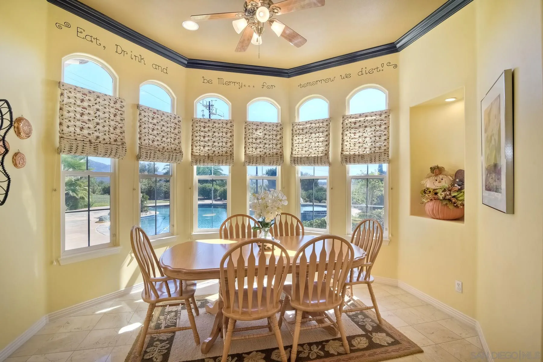 13675 Antelope Station Poway, CA 92064 - Photo 10 of 33 a view of a dining room with furniture large windows and wooden floor