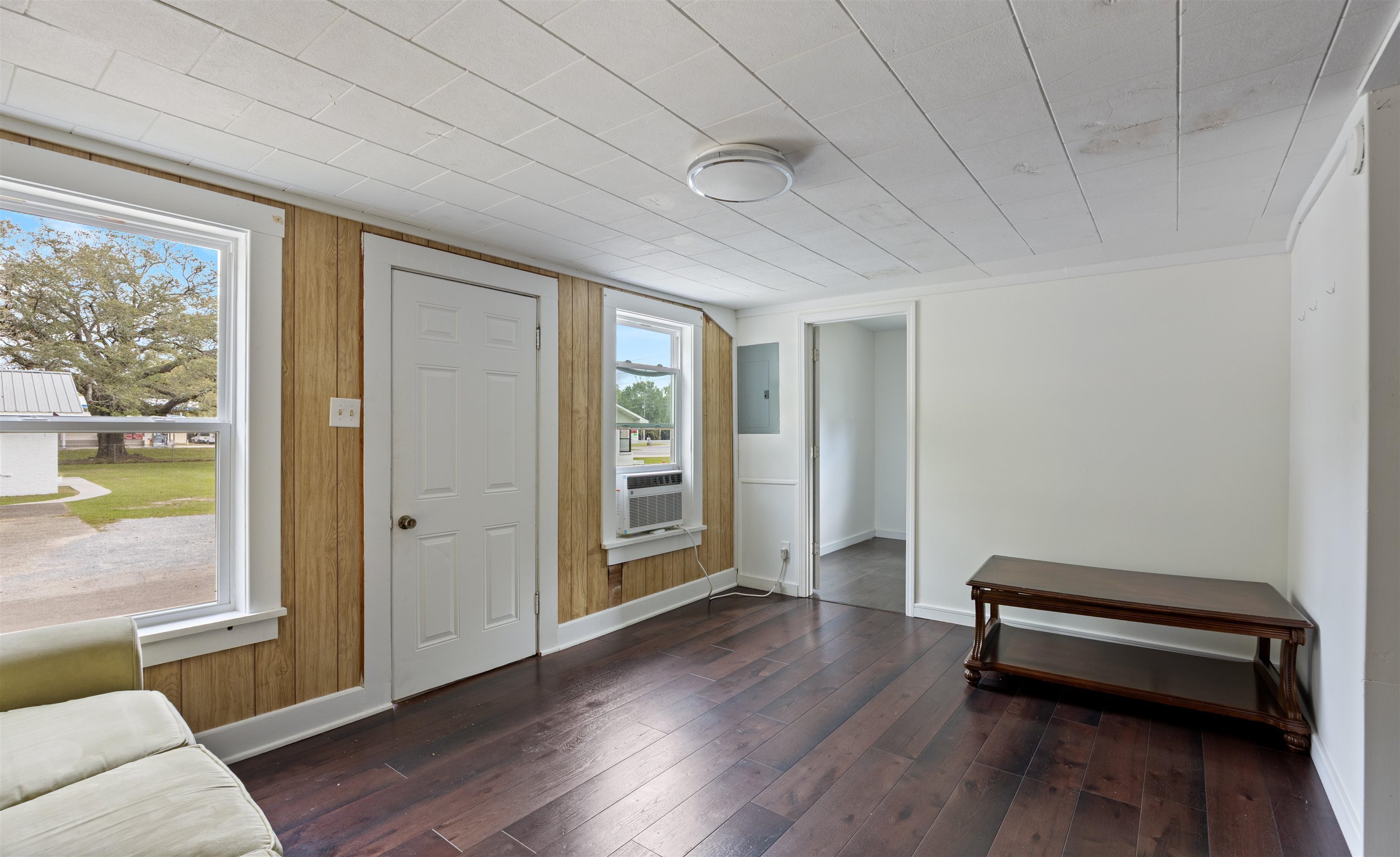 112 South Juniper Street Foley, AL 36535 - Photo 14 of 64 Foyer entrance featuring dark wood finished floors and electric panel