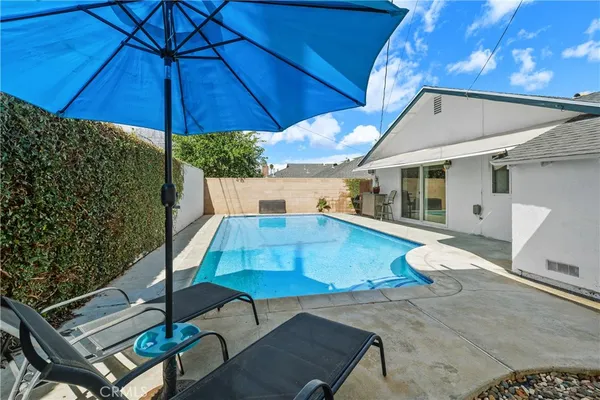 a patio with a patio table and chairs