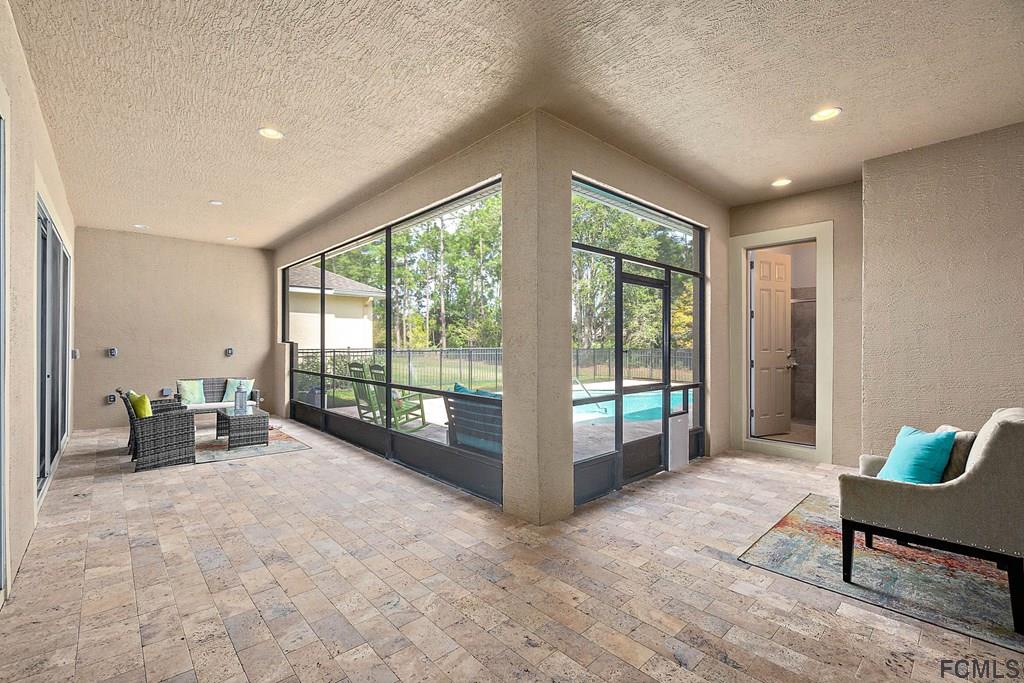 902 Creekwood Drive Ormond Beach, FL 32174 - Photo 27 of 42 Screened in Lanai