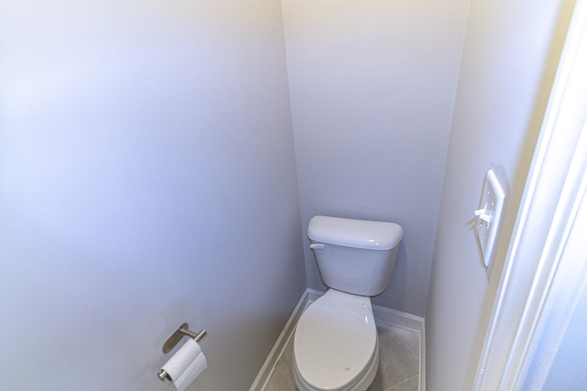 2422 Crimson Ridge Lane Cordova, TN 38016 - Photo 21 of 36 Bathroom featuring toilet and baseboards