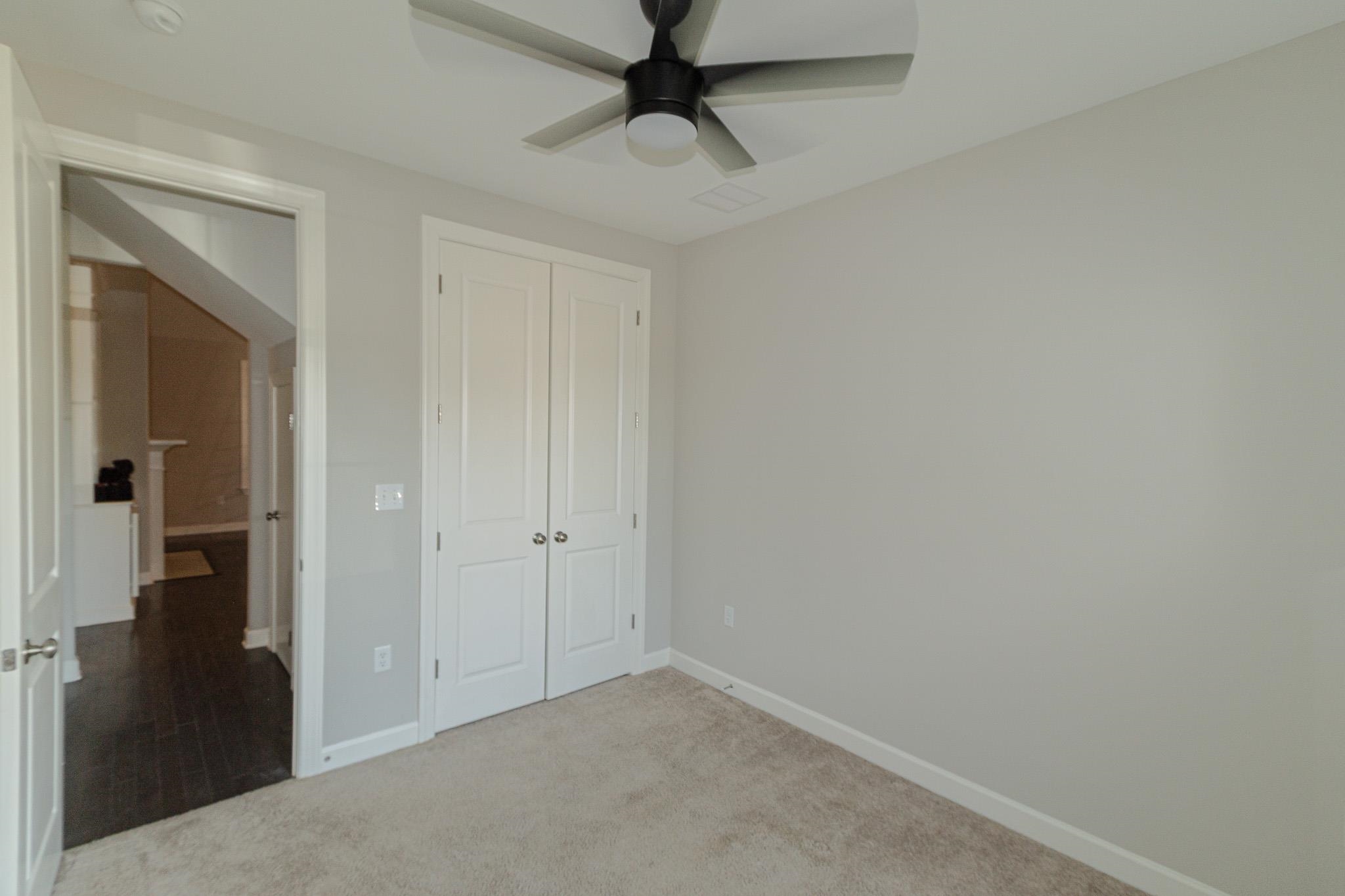 2422 Crimson Ridge Lane Cordova, TN 38016 - Photo 22 of 36 Unfurnished bedroom featuring carpet flooring, a closet, and a ceiling fan