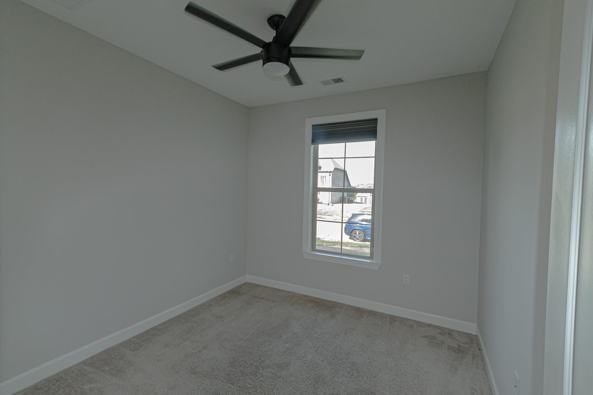 2422 Crimson Ridge Lane Cordova, TN 38016 - Photo 23 of 36 Spare room featuring light carpet and ceiling fan