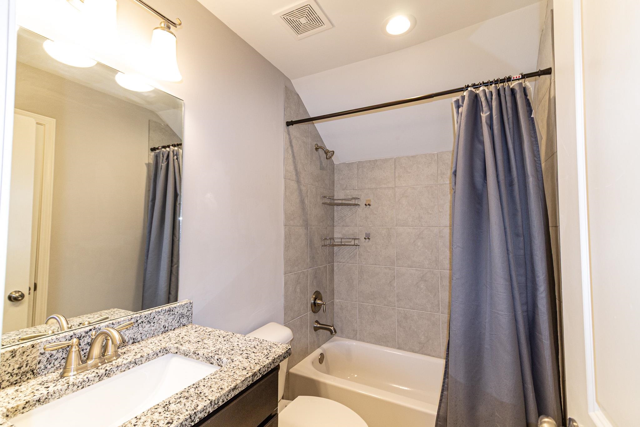 2422 Crimson Ridge Lane Cordova, TN 38016 - Photo 27 of 36 Full bathroom featuring vanity and shower / bath combo with shower curtain
