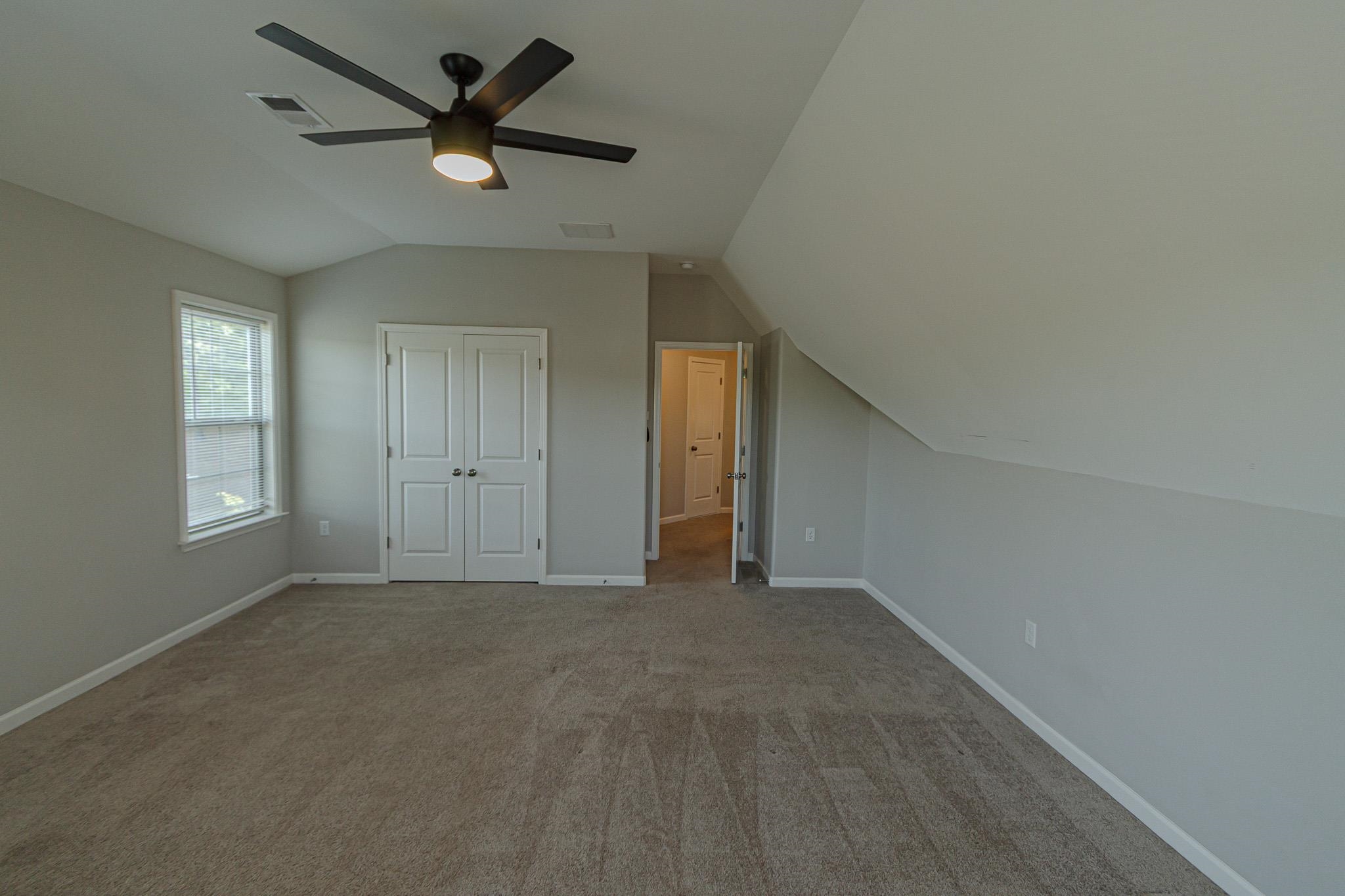 2422 Crimson Ridge Lane Cordova, TN 38016 - Photo 28 of 36 Unfurnished bedroom with carpet flooring, a closet, and ceiling fan