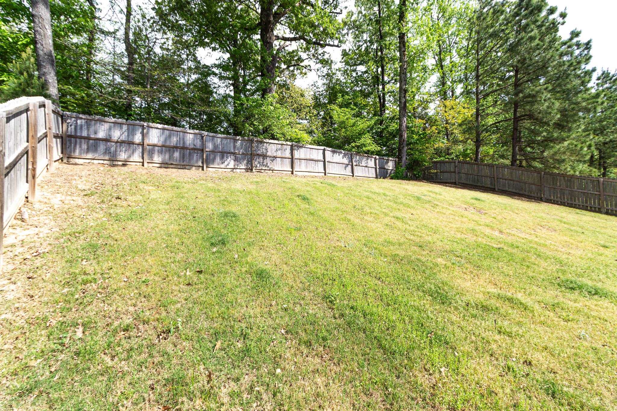2422 Crimson Ridge Lane Cordova, TN 38016 - Photo 35 of 36 Fenced backyard with view of wooded area