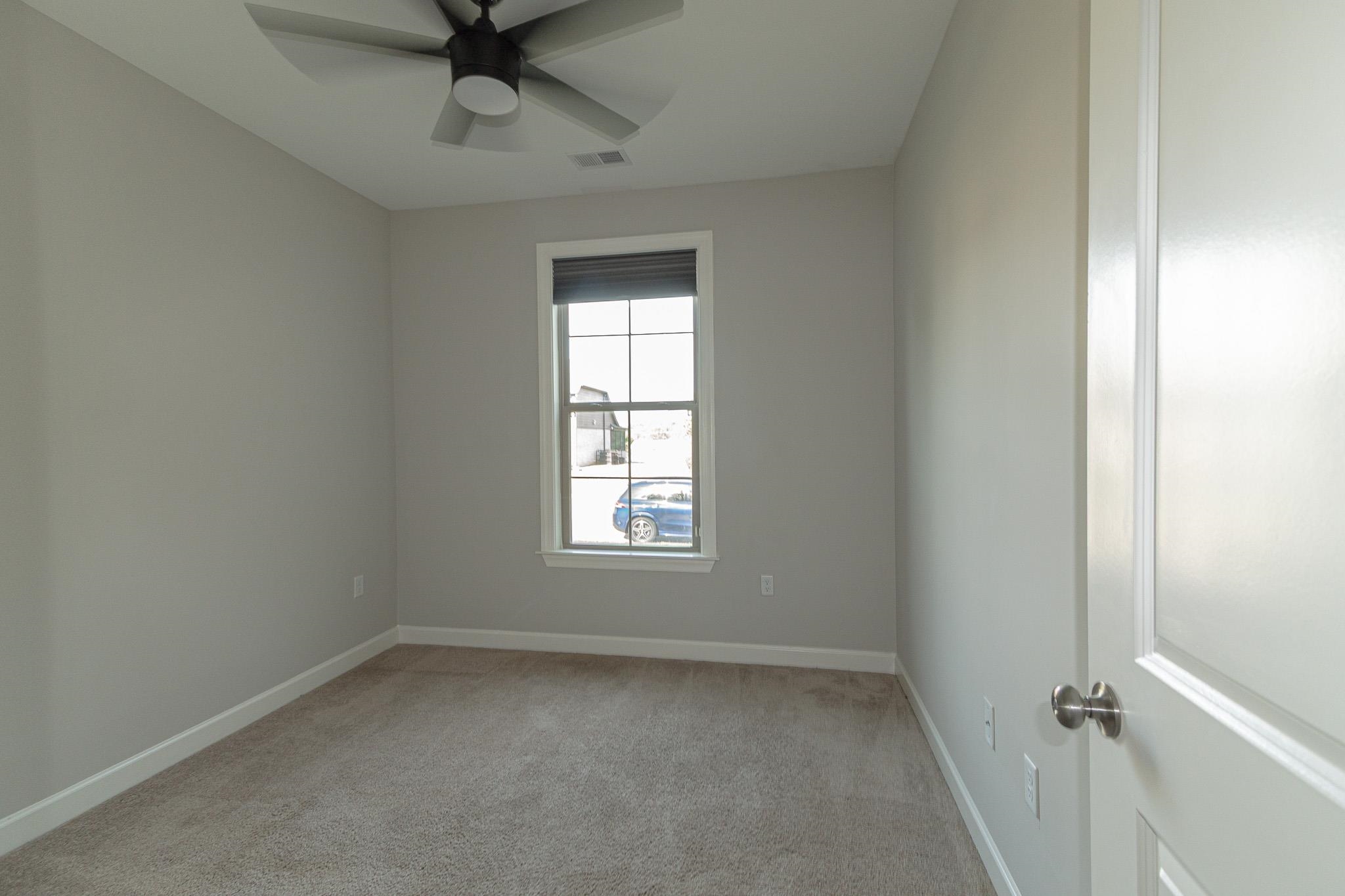 2422 Crimson Ridge Lane Cordova, TN 38016 - Photo 8 of 36 Unfurnished room featuring light colored carpet and ceiling fan