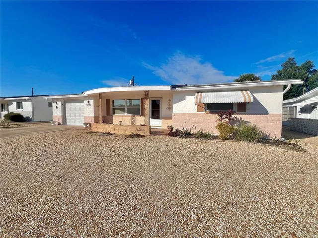 a view of a house with a big yard