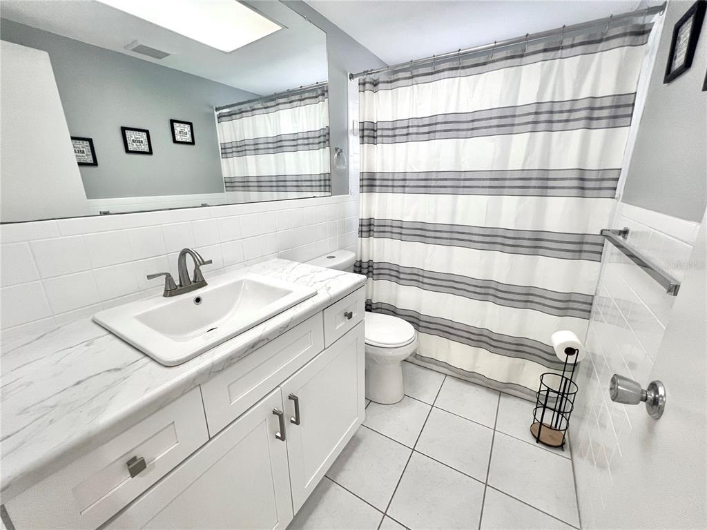 5145 Cicero Drive New Port Richey, FL 34652 - Photo 13 of 19 a bathroom with a sink toilet and shower