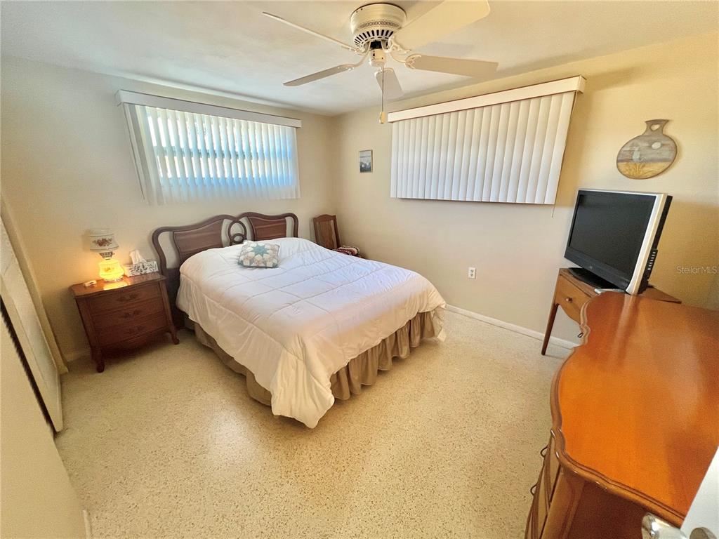 5145 Cicero Drive New Port Richey, FL 34652 - Photo 14 of 19 a bedroom with a bed dresser and a window