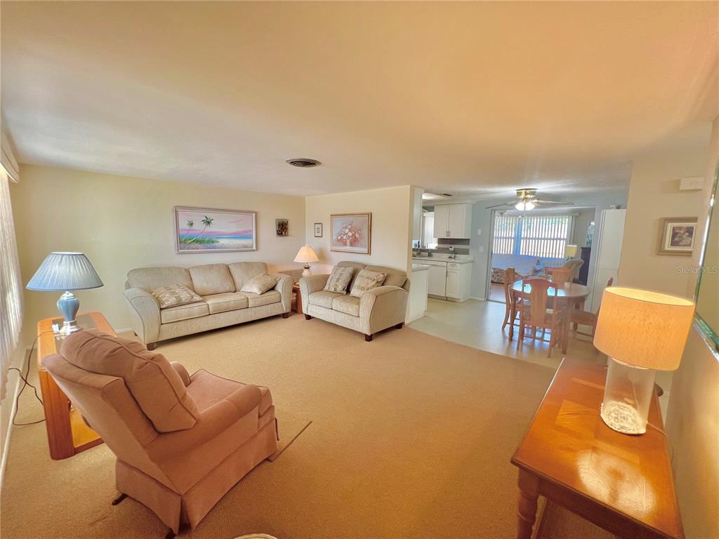 5145 Cicero Drive New Port Richey, FL 34652 - Photo 3 of 19 a living room with furniture and a table