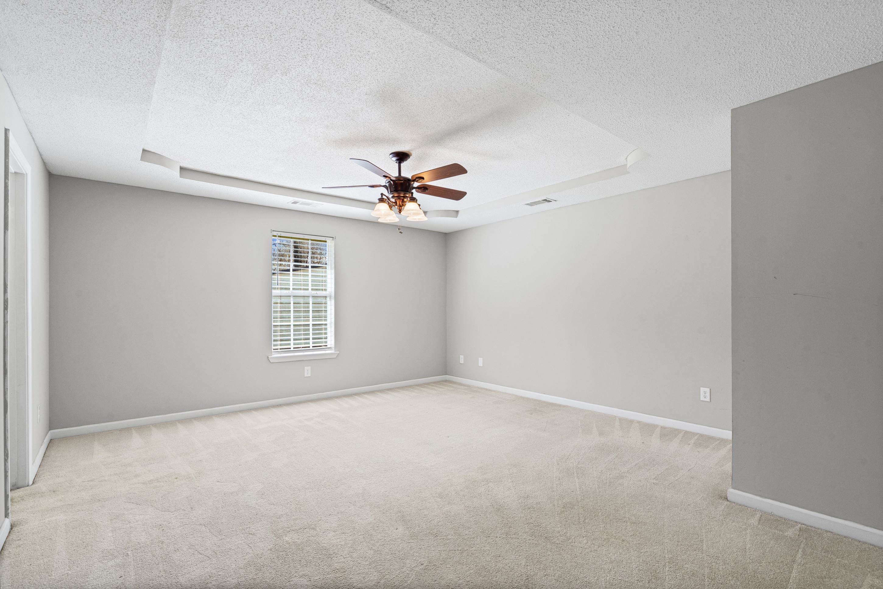 511 Rae Drive Munford, TN 38058 - Photo 10 of 30 a view of a livingroom with a ceiling fan and window