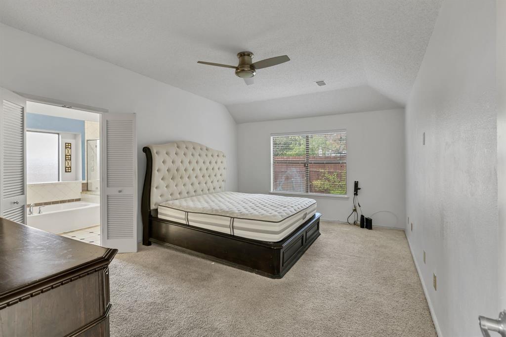 8405 Spinnaker Cove Rowlett, TX 75089 - Photo 17 of 30 a bedroom with a bed and window