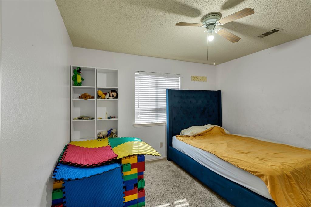 8405 Spinnaker Cove Rowlett, TX 75089 - Photo 23 of 30 a bedroom with bed and window