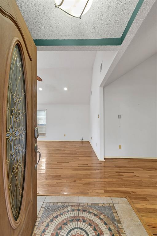 8405 Spinnaker Cove Rowlett, TX 75089 - Photo 5 of 30 a view of water heater room with a bathtub