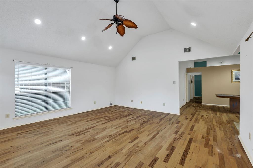 8405 Spinnaker Cove Rowlett, TX 75089 - Photo 9 of 30 a view of empty room with wooden floor and fan
