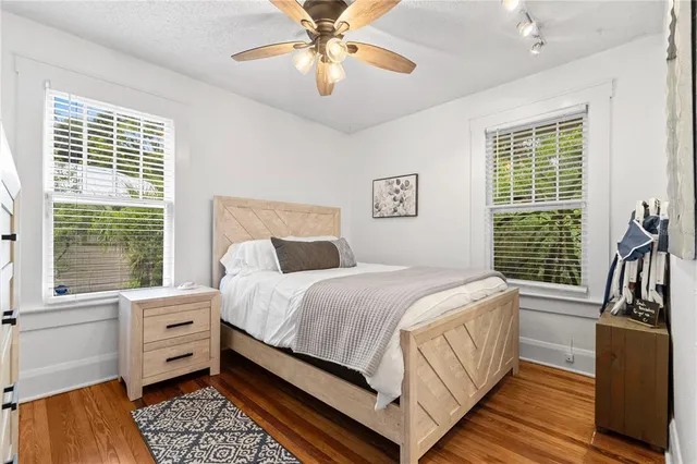 a bed room with a bed and a chandelier