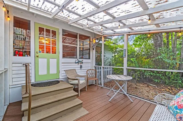 a view of deck with furniture and garden