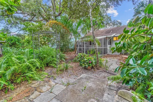 a backyard of a house with outdoor seating