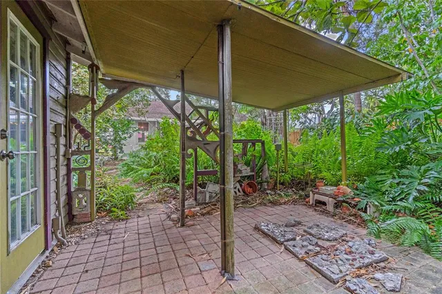 a view of a room with furniture and a window