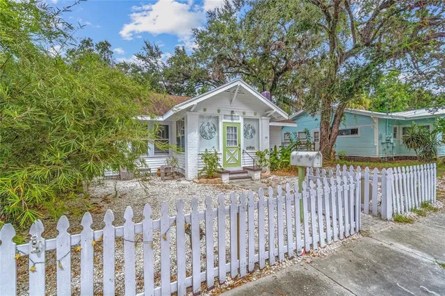 a front view of a house with outdoor seating