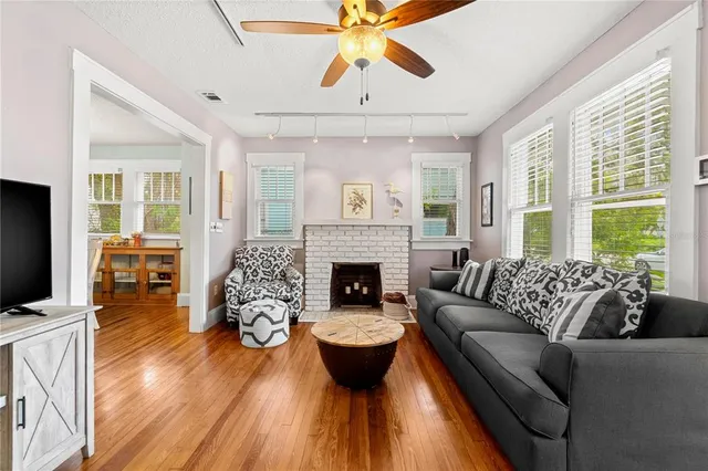 a living room with furniture and a fireplace