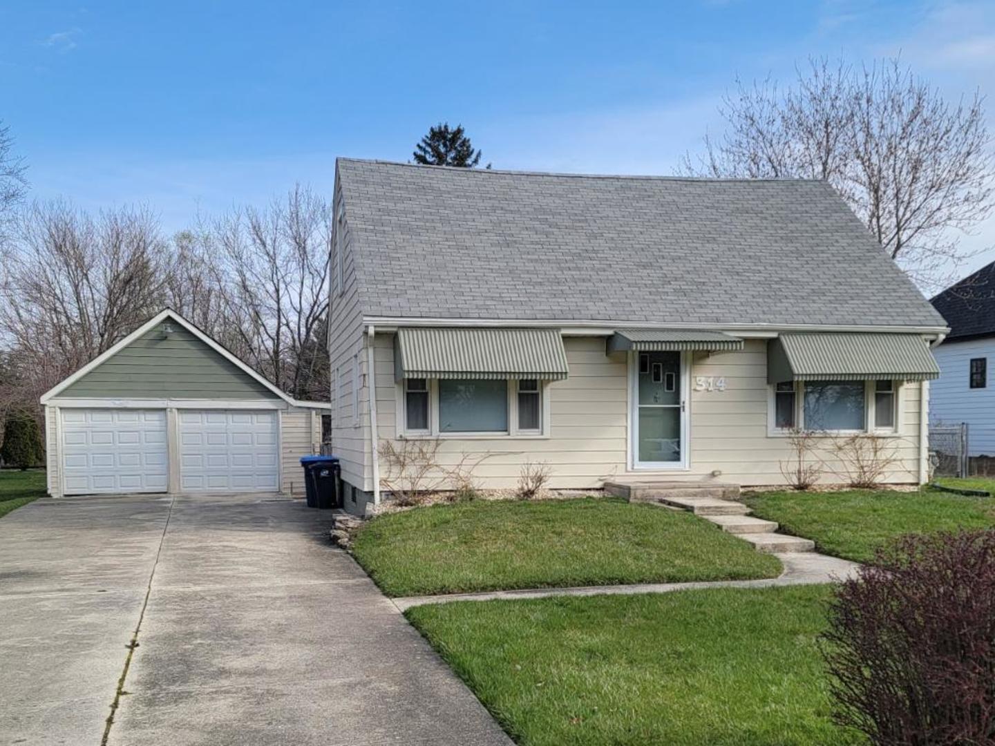 314 Roger Road Darien, IL 60561 - Photo 1 of 1 a front view of a house with a garden