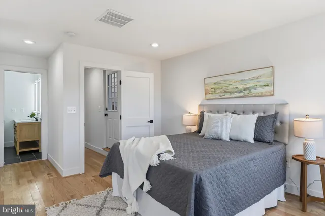 a bedroom with a large bed and a couch