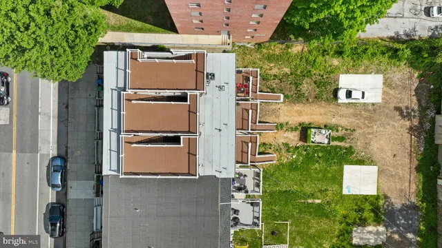an aerial view of a house with a yard and garage