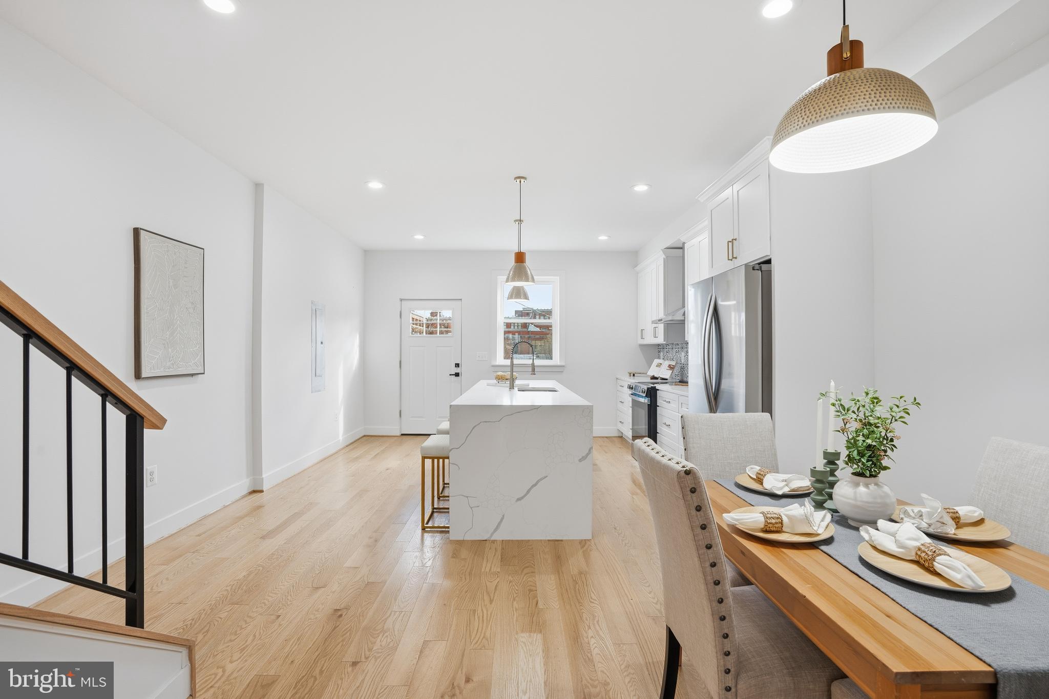 3923 Roland Avenue Baltimore, MD 21211 - Photo 3 of 30 a dining room with furniture and wooden floor