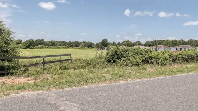 a view of lake with green space