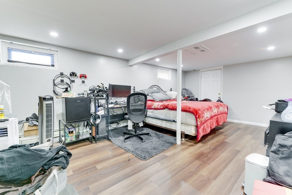 22 Clark Street Randolph, MA 02368 - Photo 14 of 26 a bedroom with a bed and a flat screen tv