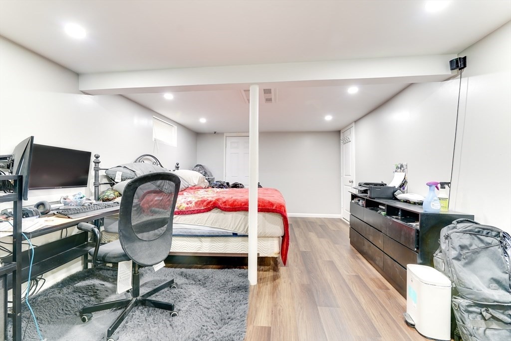 22 Clark Street Randolph, MA 02368 - Photo 15 of 26 a room with furniture and air hockey table