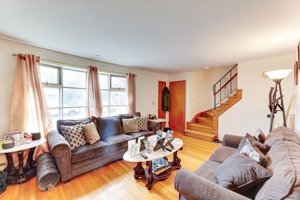 22 Clark Street Randolph, MA 02368 - Photo 17 of 26 a living room with furniture and a large window