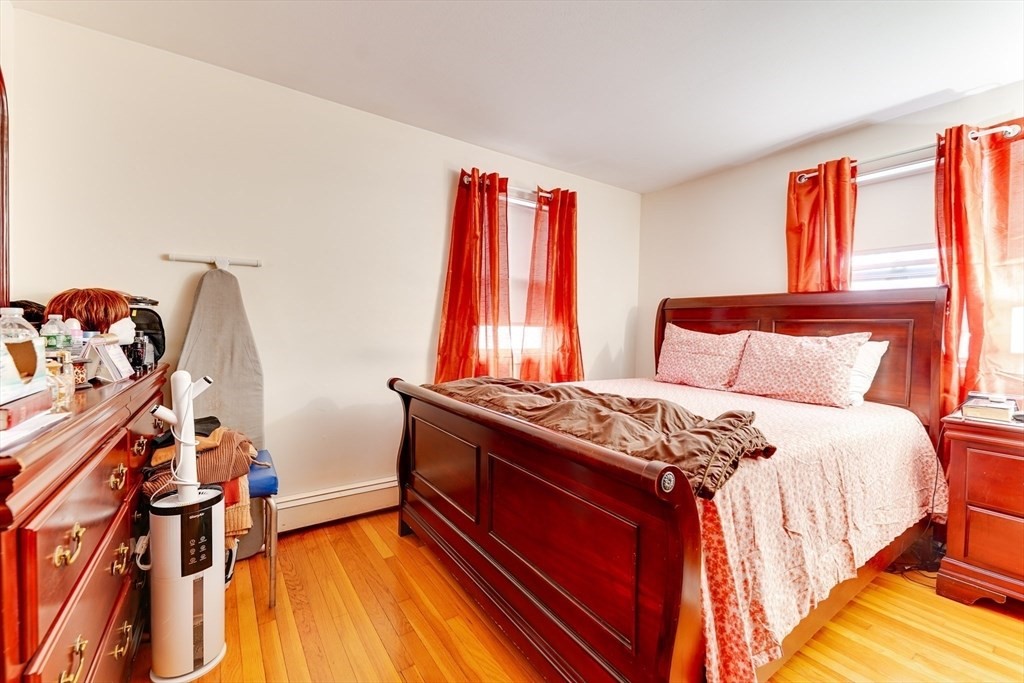 22 Clark Street Randolph, MA 02368 - Photo 20 of 26 a bedroom with a bed and a window