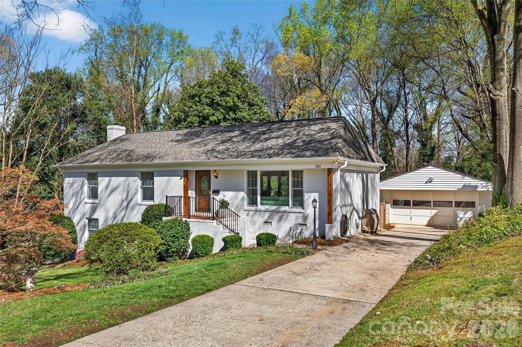 3717 Riverbend Road Charlotte, NC 28210 - Photo 1 of 41 a front view of a house with garden