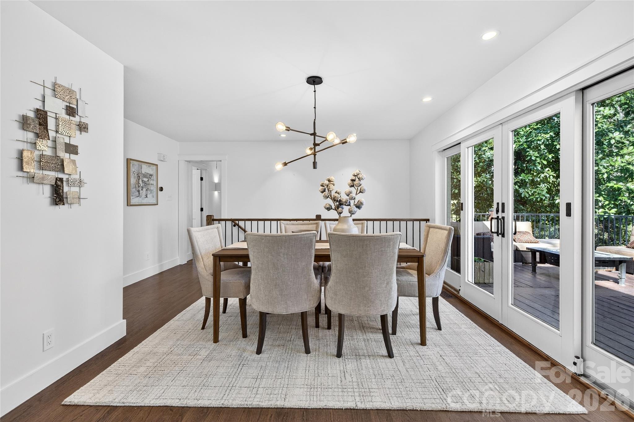 3717 Riverbend Road Charlotte, NC 28210 - Photo 15 of 41 a view of a dining room with furniture window and wooden floor