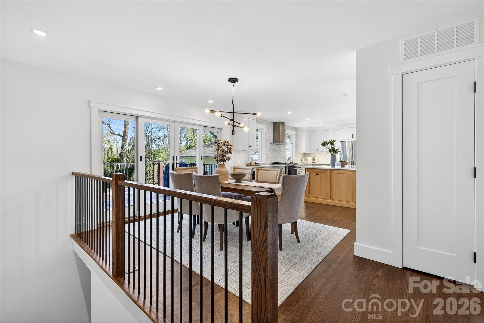 3717 Riverbend Road Charlotte, NC 28210 - Photo 16 of 41 a view of a dining room with furniture window and wooden floor