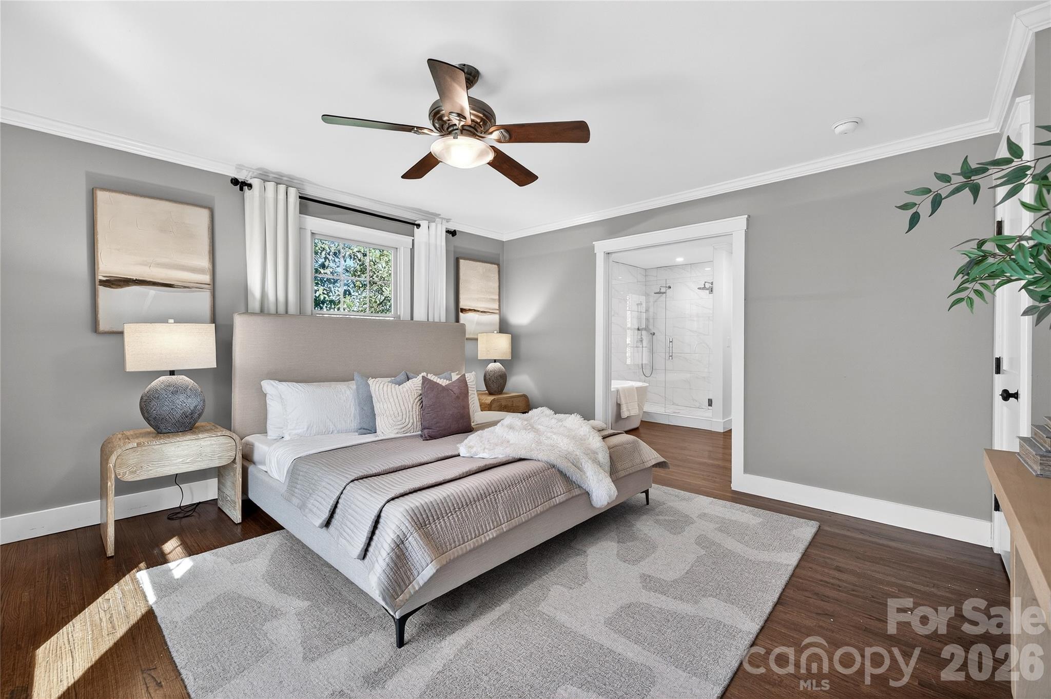 3717 Riverbend Road Charlotte, NC 28210 - Photo 18 of 41 a bedroom with a large bed and a chandelier