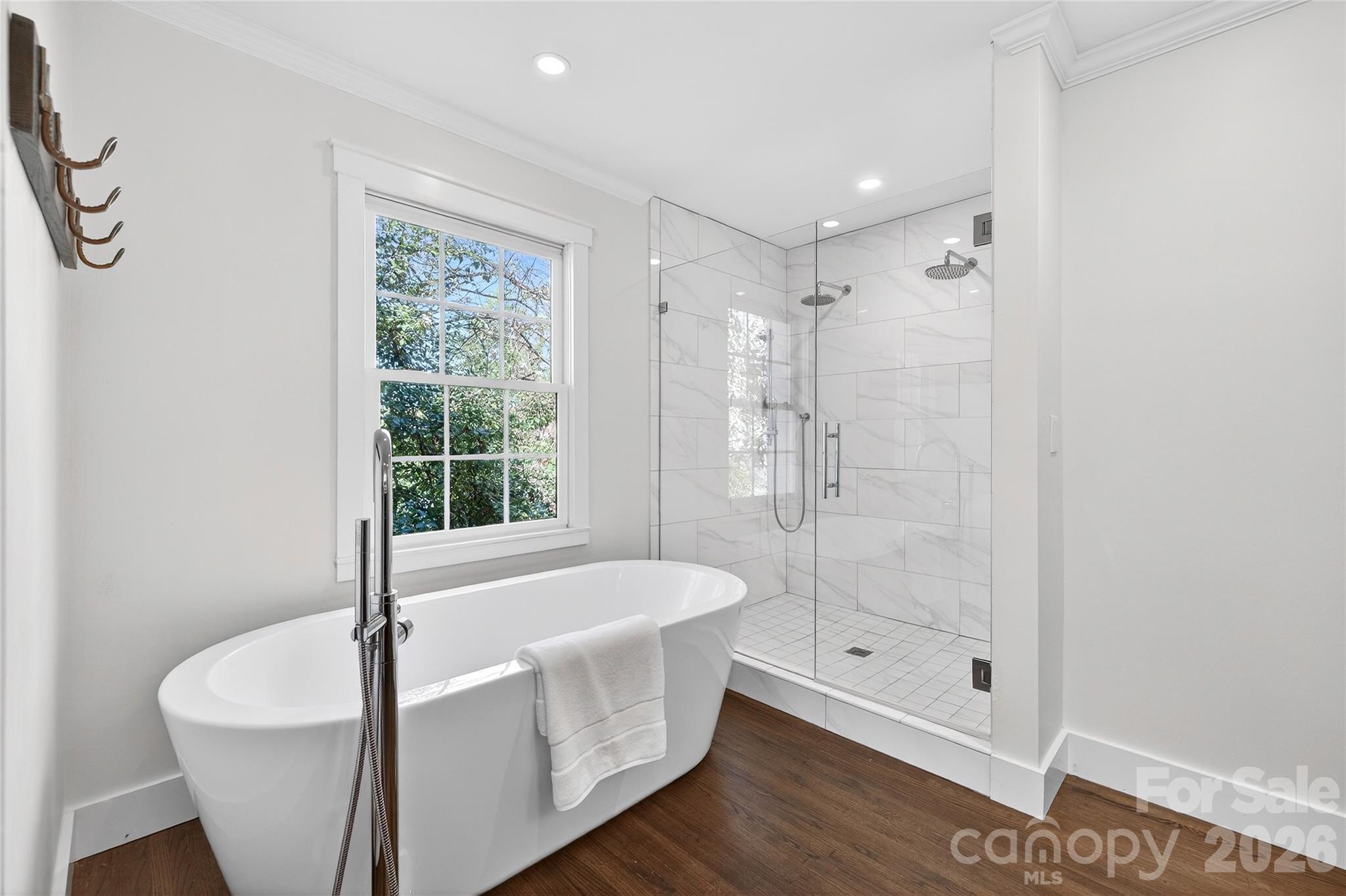 3717 Riverbend Road Charlotte, NC 28210 - Photo 20 of 41 a bathroom with a bathtub and shower