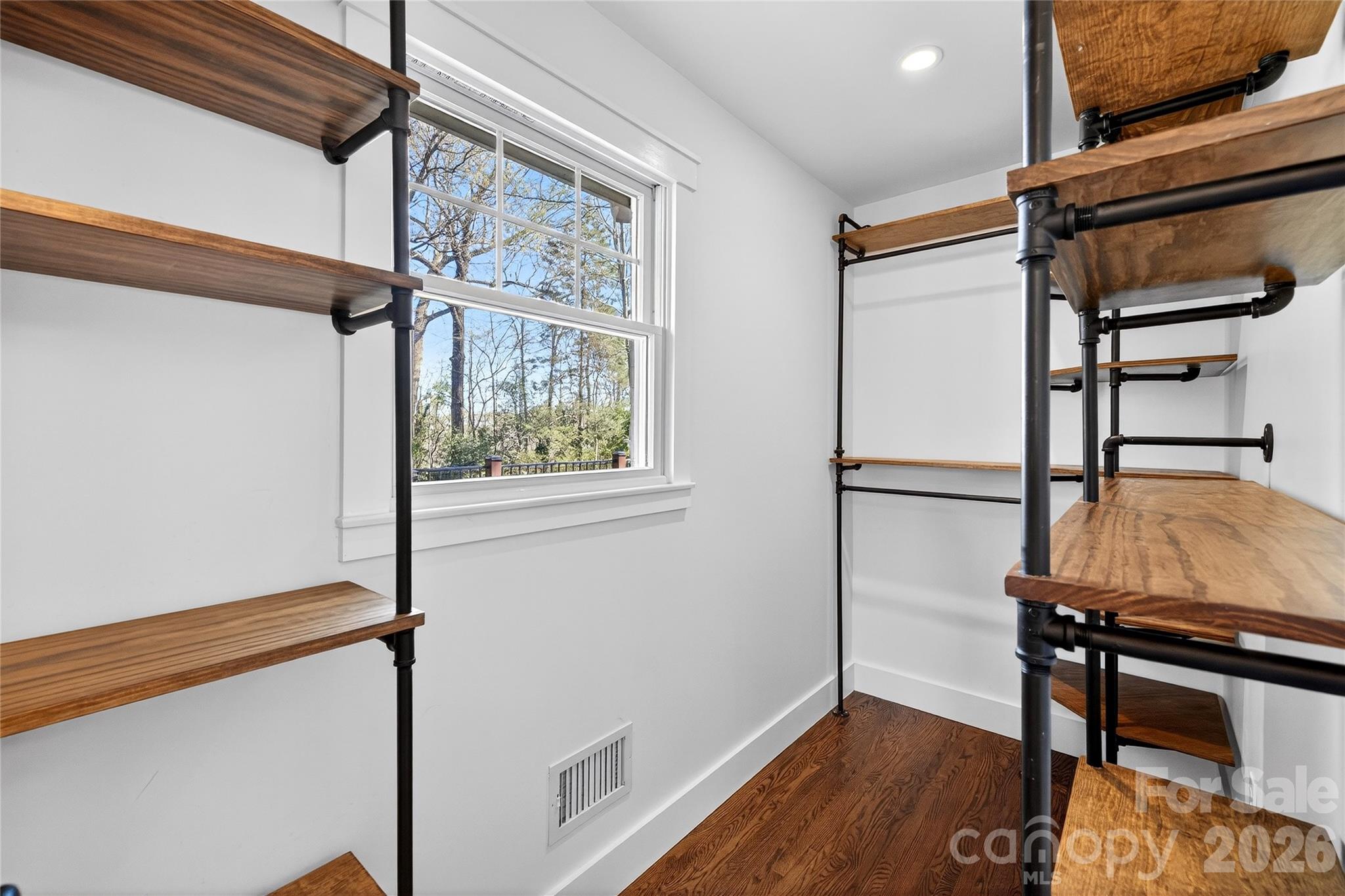 3717 Riverbend Road Charlotte, NC 28210 - Photo 23 of 41 a view of a hallway with wooden floor and staircase