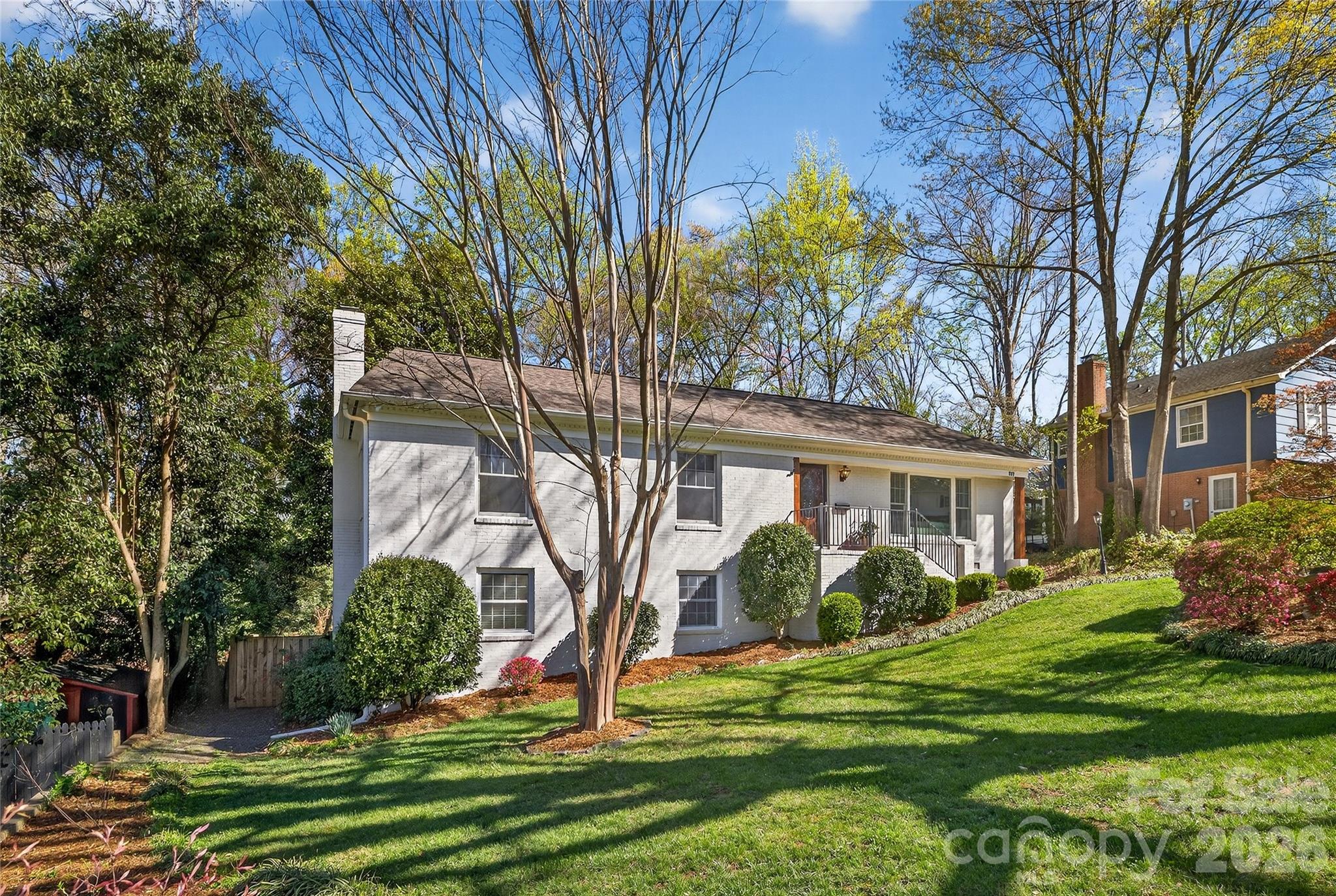 3717 Riverbend Road Charlotte, NC 28210 - Photo 31 of 41 a front view of a house with garden and trees